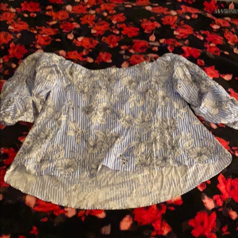 A blue and white off the shoulder top